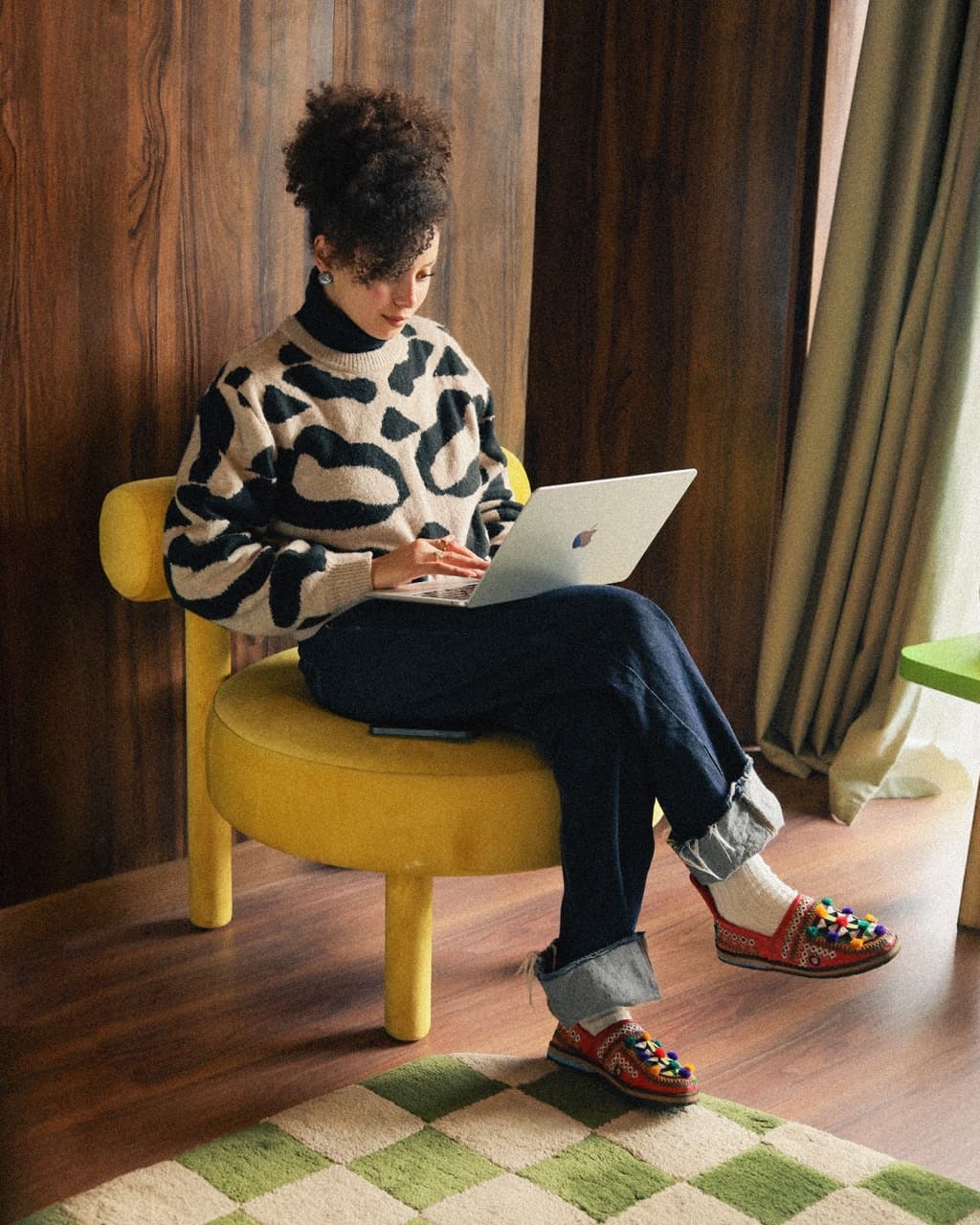 Guest working in a stylish StayHere suite